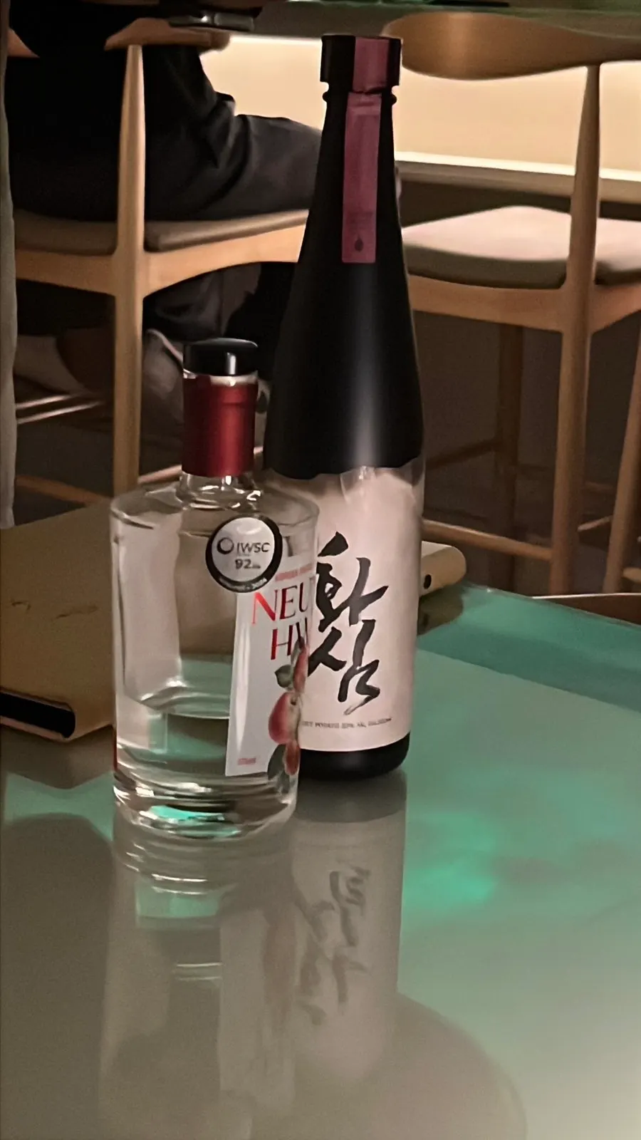 Glass of distilled spirit set on Moss's bar counter