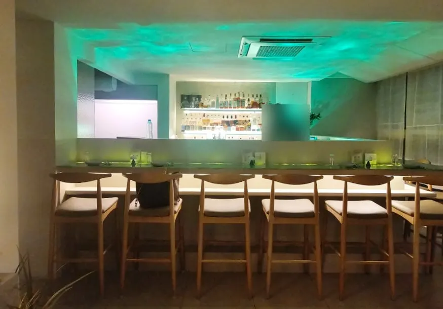 Interior of Moss bathed in blue lighting