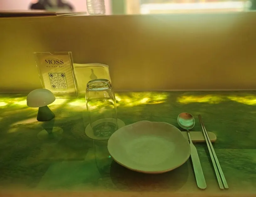 Bar table at Moss under soft lighting