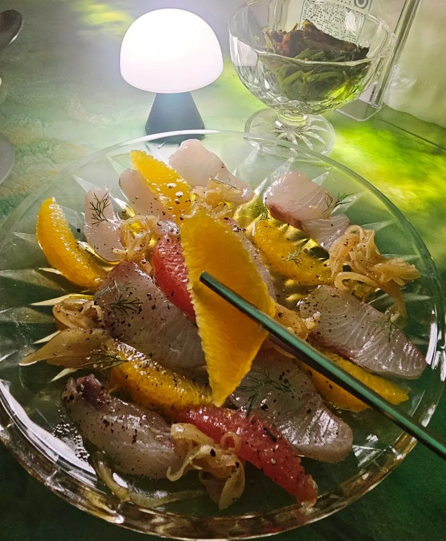 Seasonal sashimi ceviche topped with orange and grapefruit