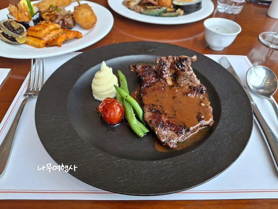 Flat iron steak served at the table