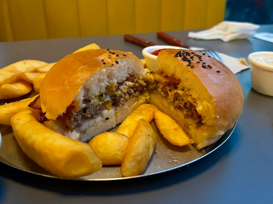 Burger showing hanwoo patty and house-smoked bacon