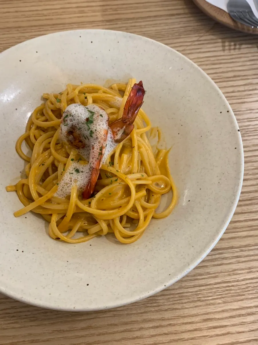 Photo of bisque pasta topped with Champagne foam