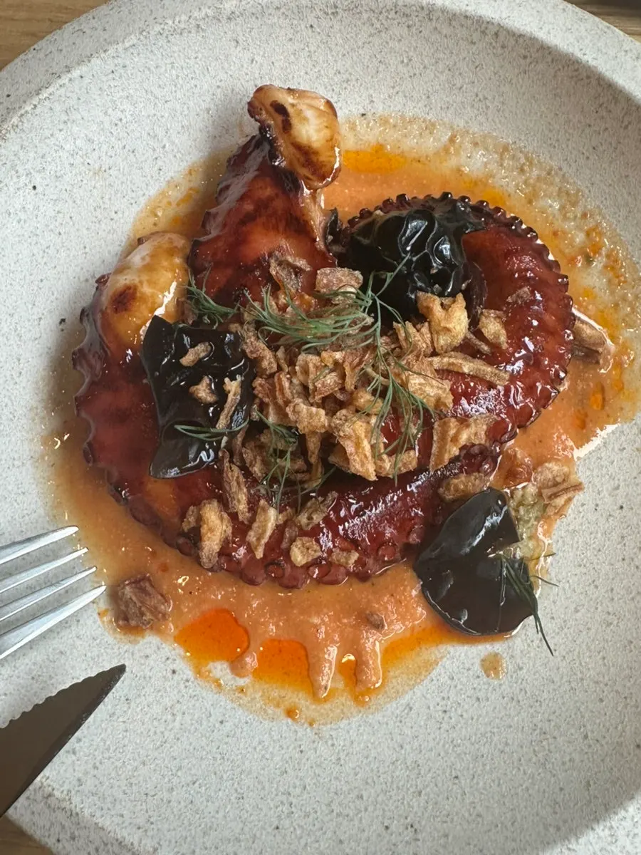 Charcoal octopus and romesco sauce
