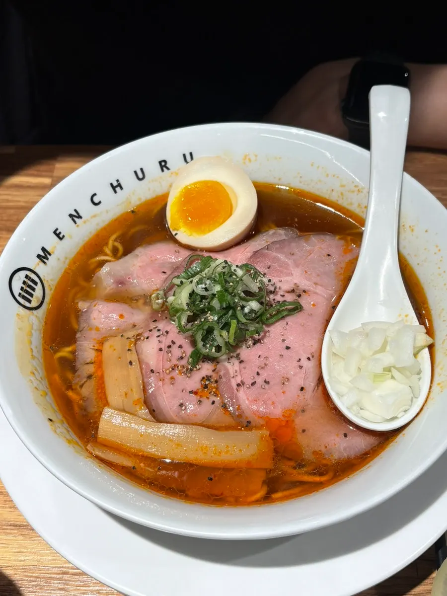Chopsticks lifting abura soba noodles