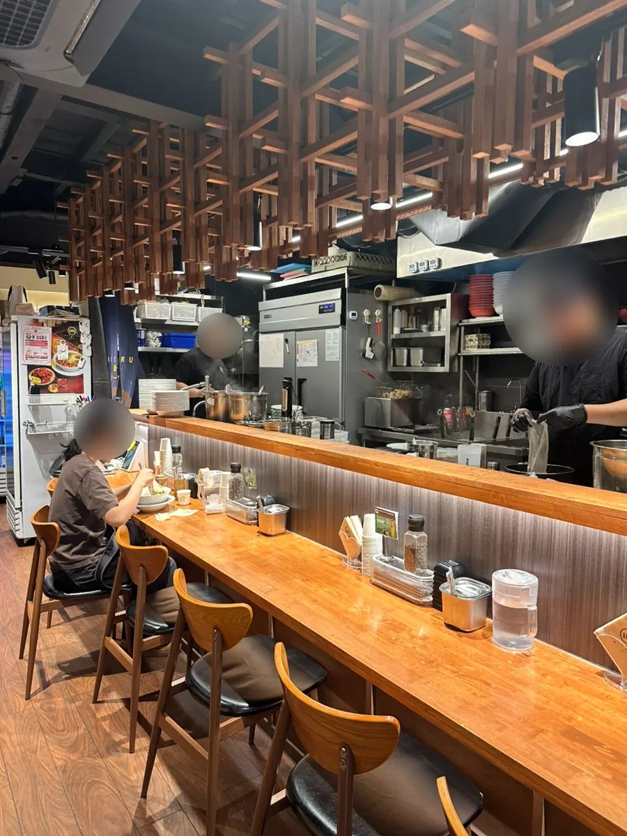 Bar seating and two-person tables inside