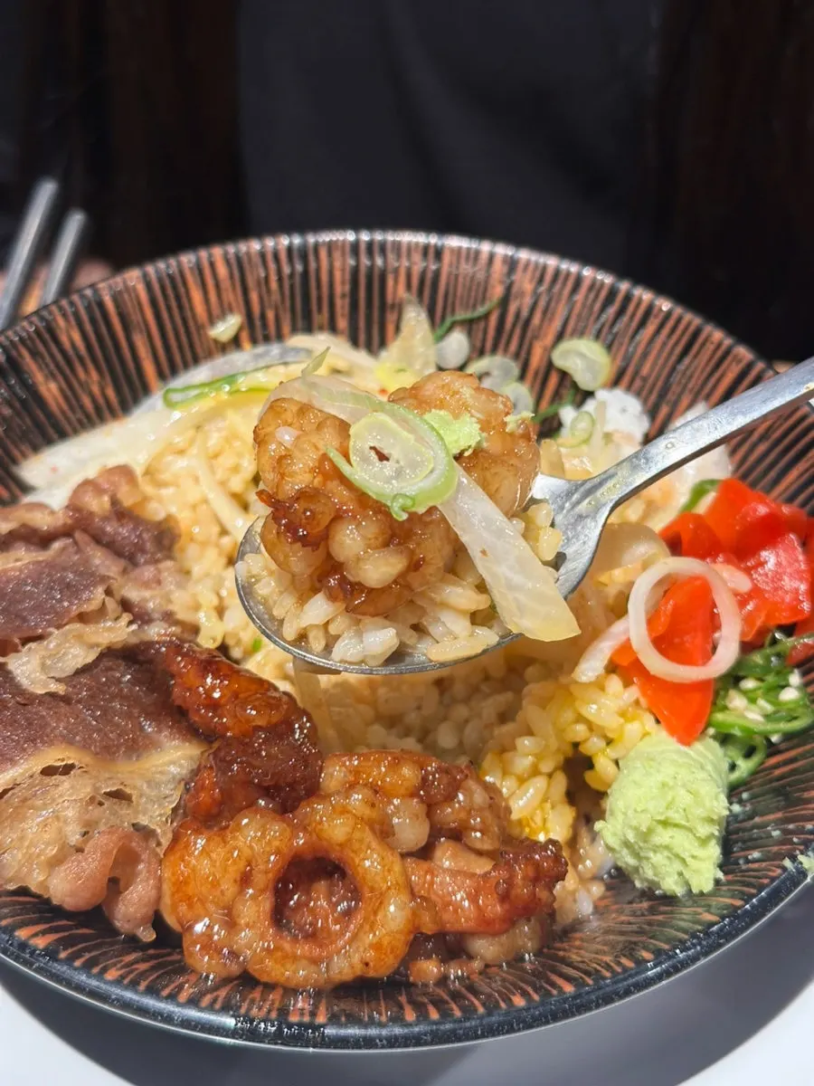 Horumon-don drizzled with house sauce