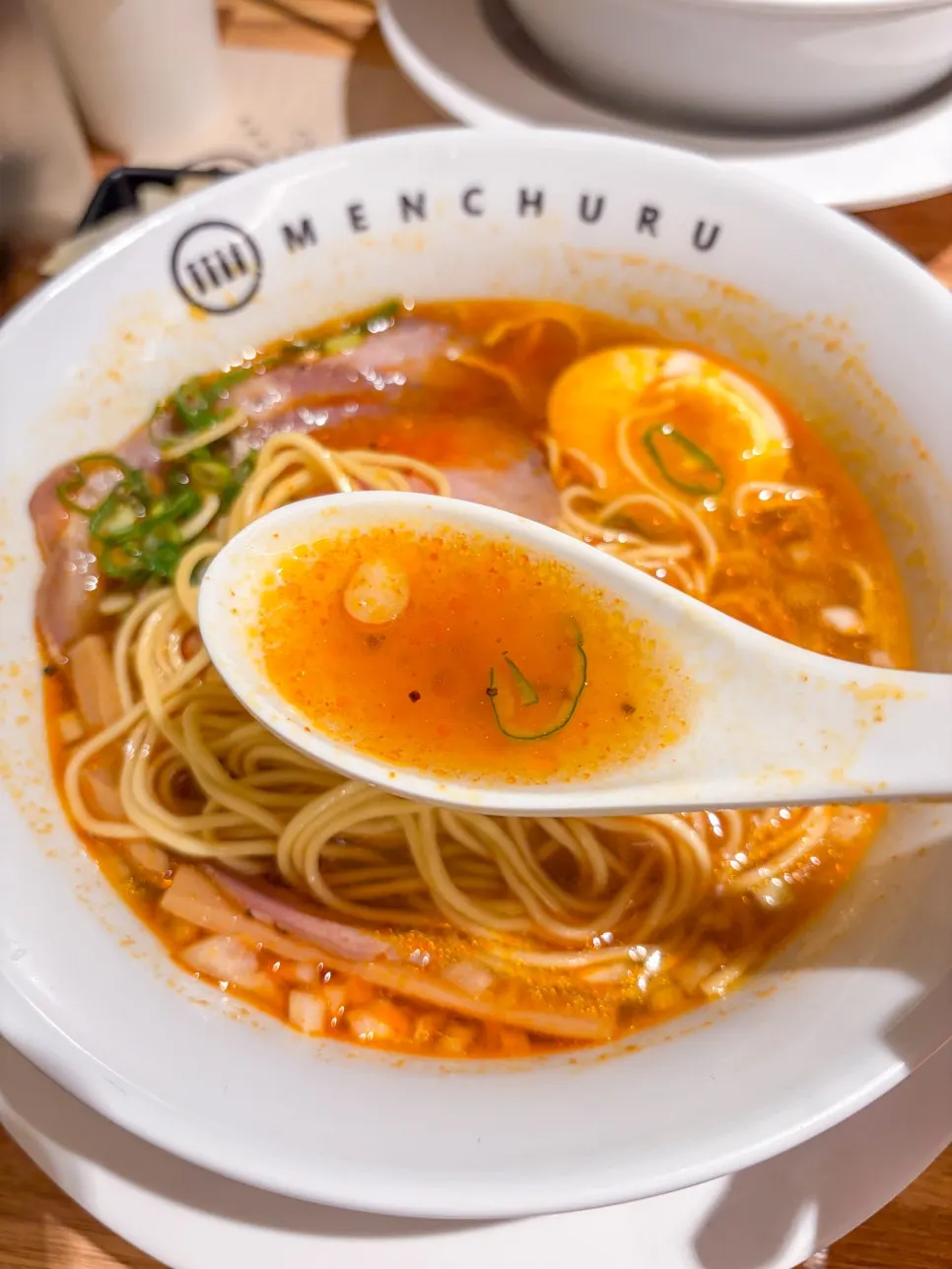 Lifting noodles from the spicy shoyu ramen