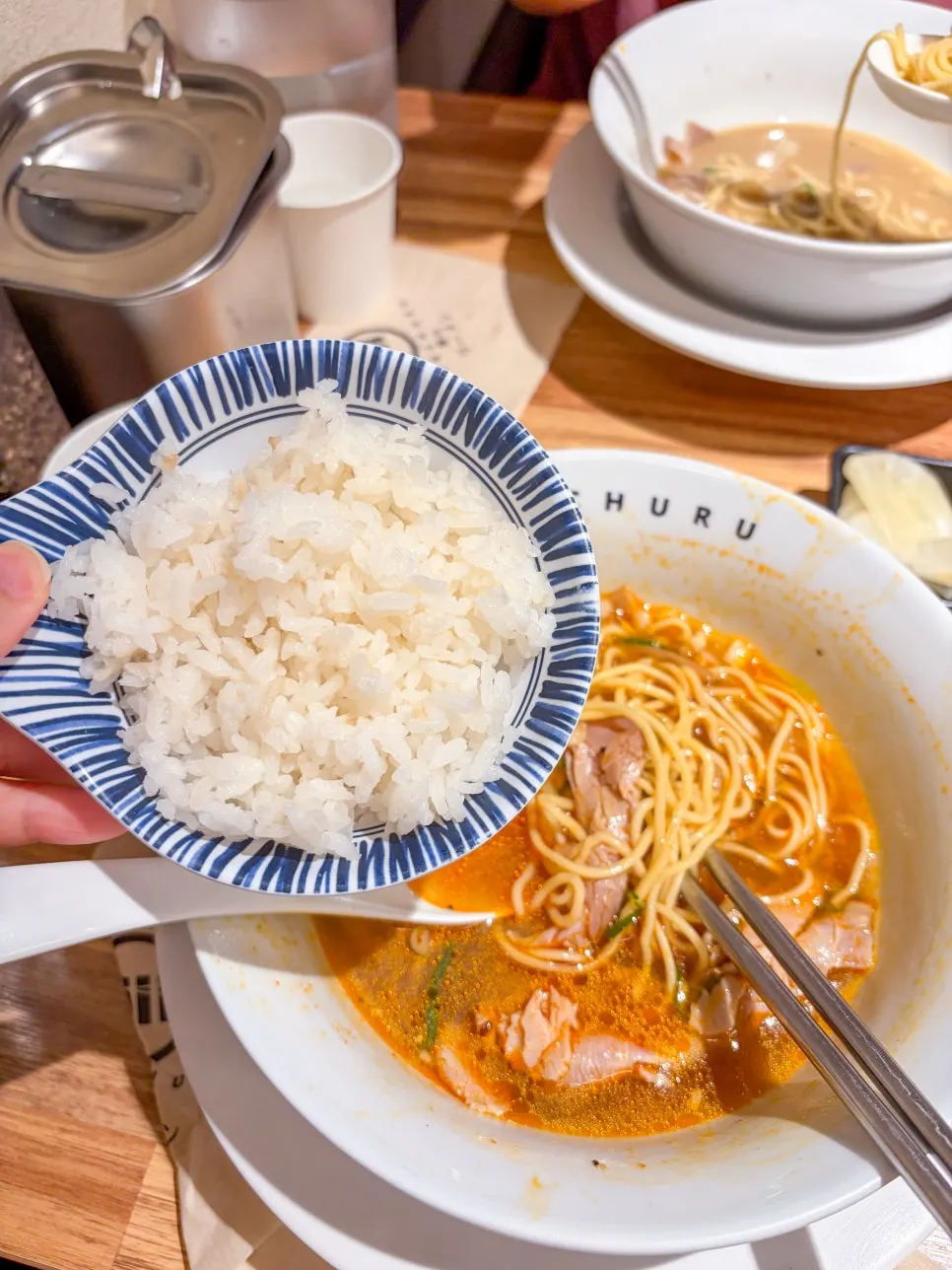 Rice mixed into ramen broth