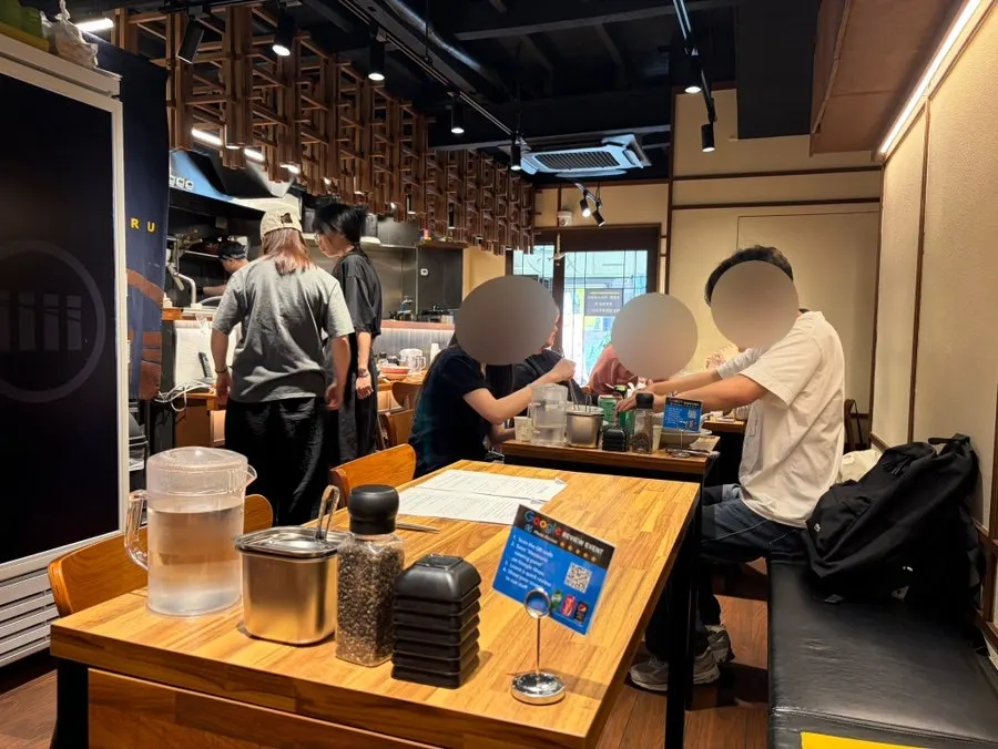 Wide shot of two ramen bowls on the table