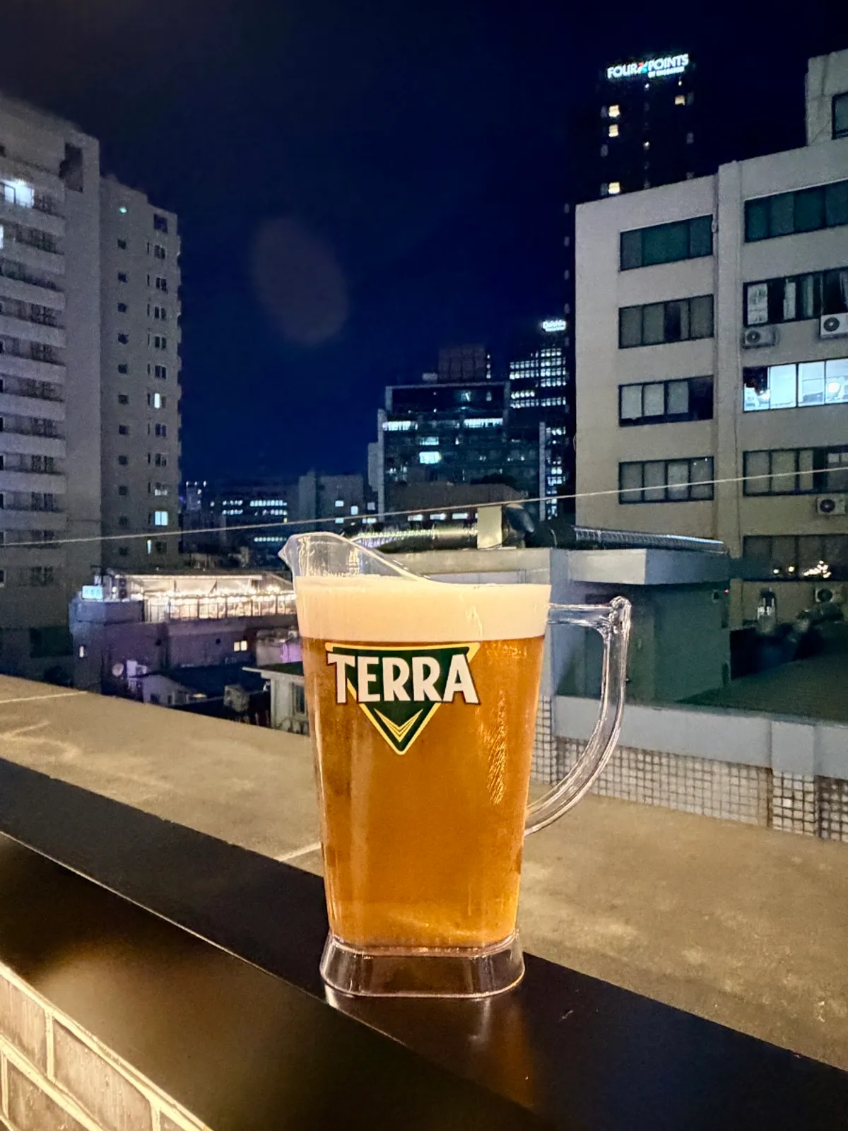 Rooftop night view and draft beer time