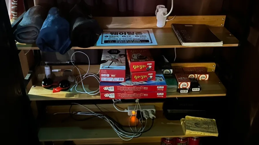 Amenity corner with chargers, hand cream, and body perfume