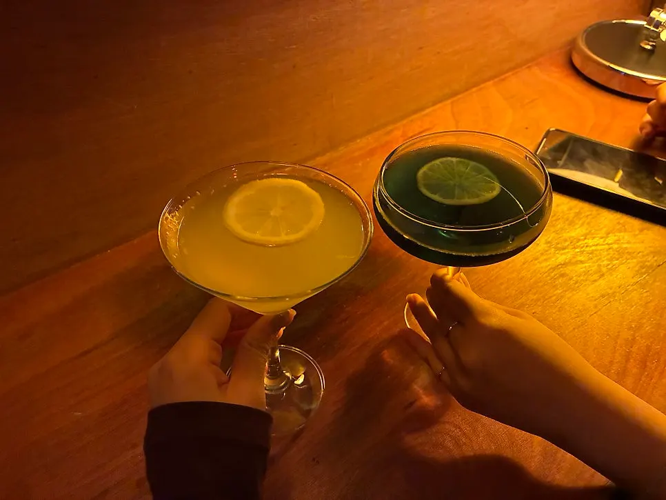Bar table seating and a cocktail while waiting