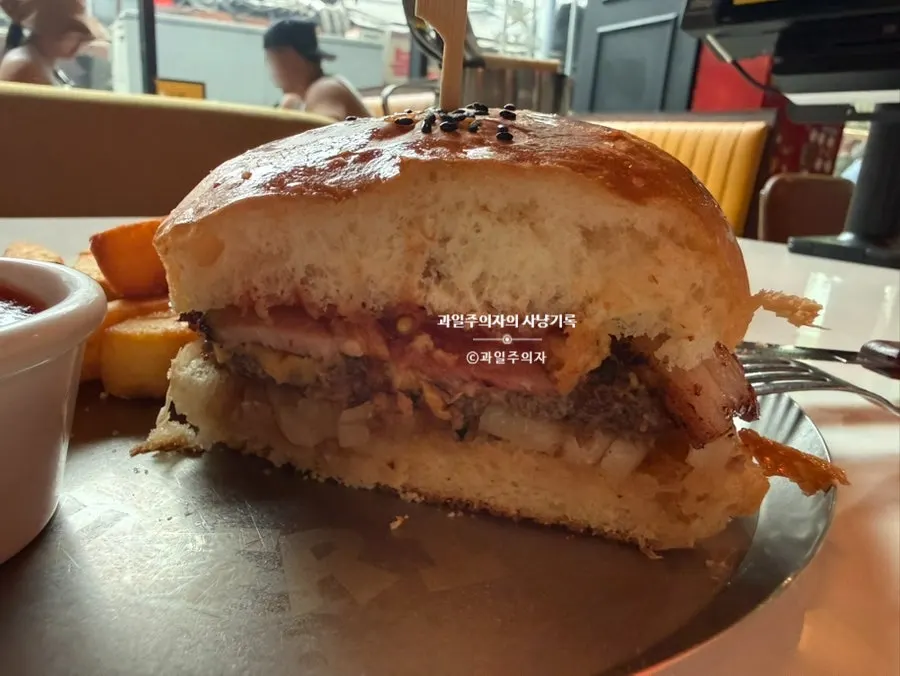 Cross-section of the burger showing patty and bacon