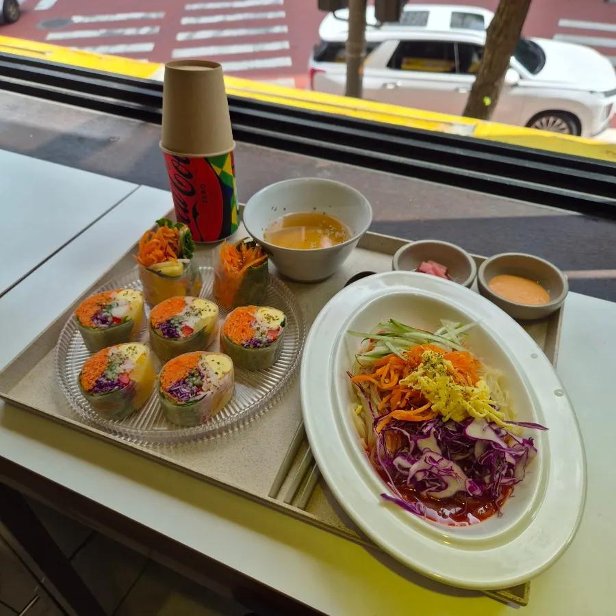 Two kinds of gimbap and jjolmyeon on the table