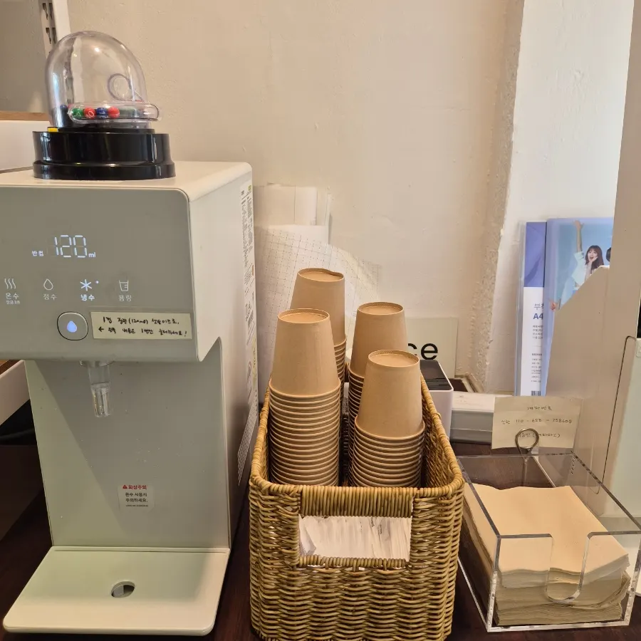 Self-serve water purifier next to the kiosk