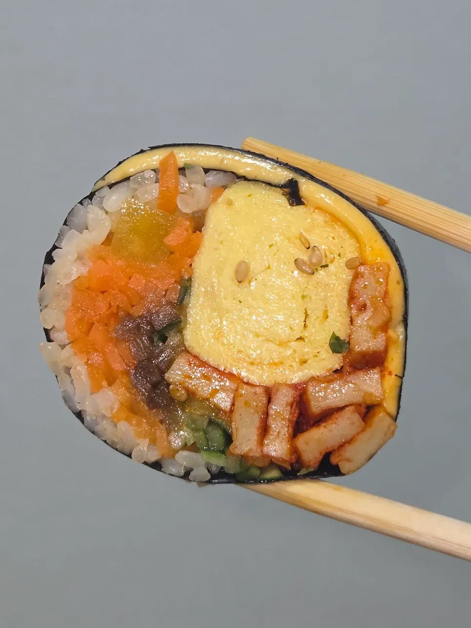 Gimbap wrapped in a whole egg omelet