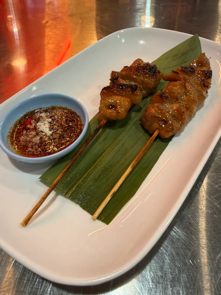 Thai moo ping paired with Singha beer