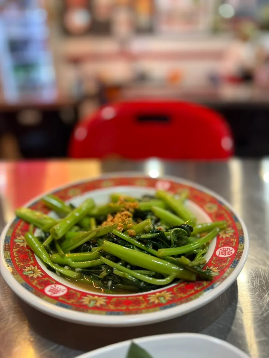 Thai stir-fried water spinach with a crisp texture