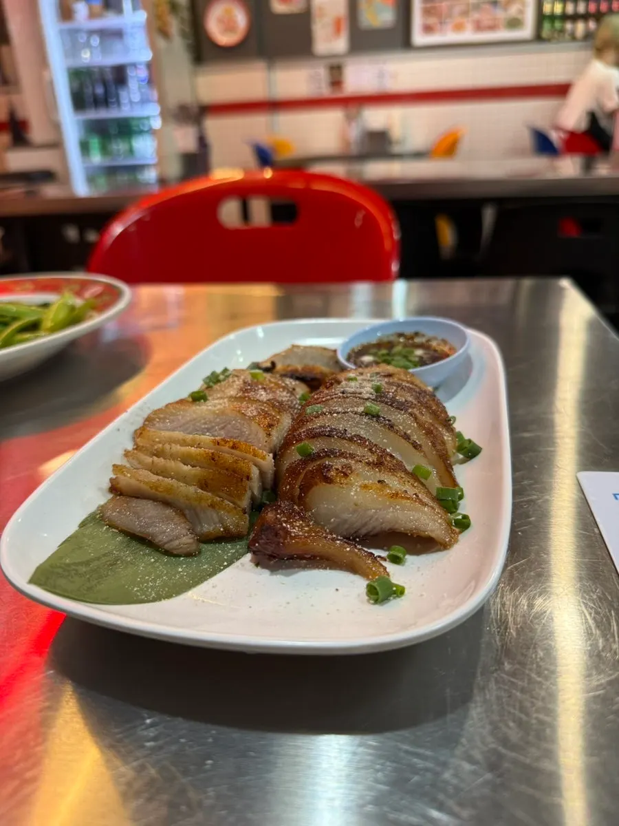 Moo ping, kor moo yang, and stir-fried water spinach combination