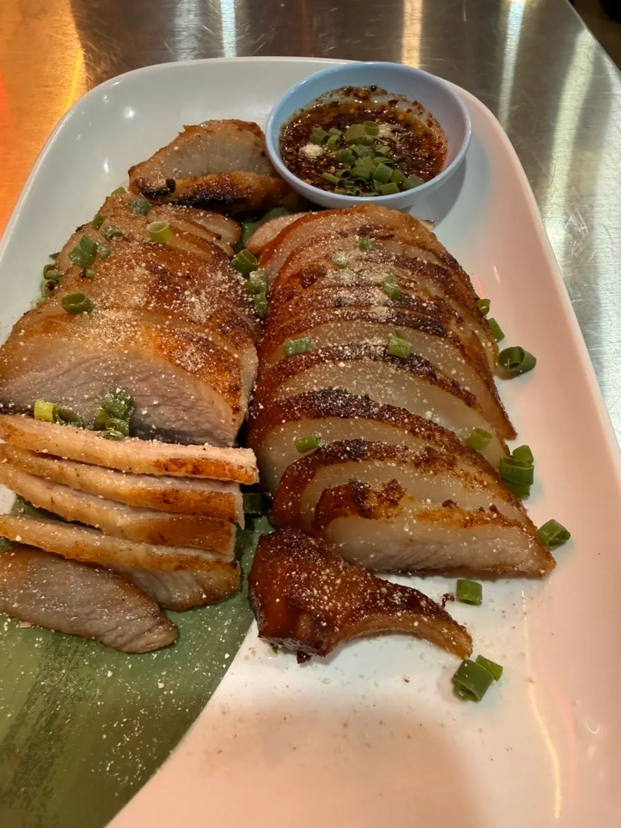Thinly sliced Thai grilled pork, kor moo yang