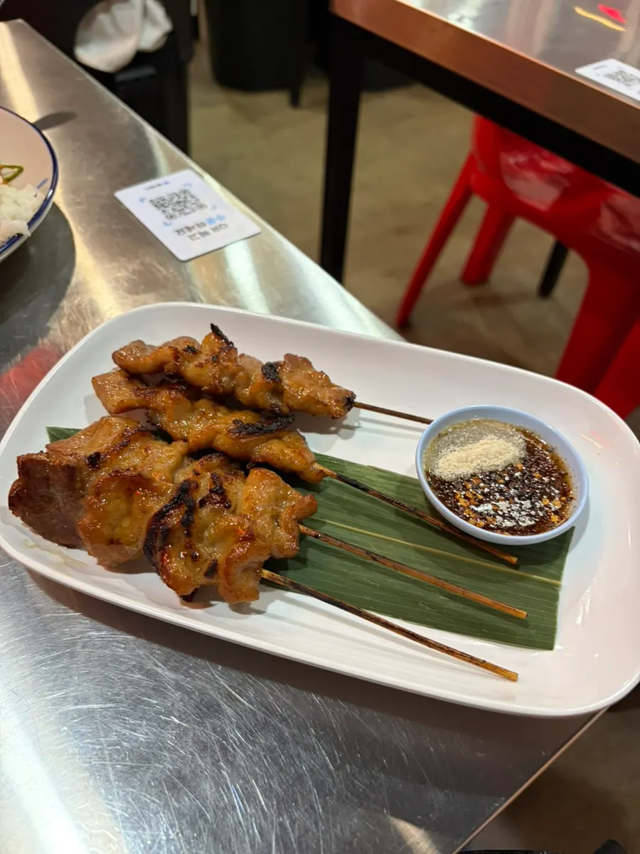 Four pieces of open-flame grilled moo ping
