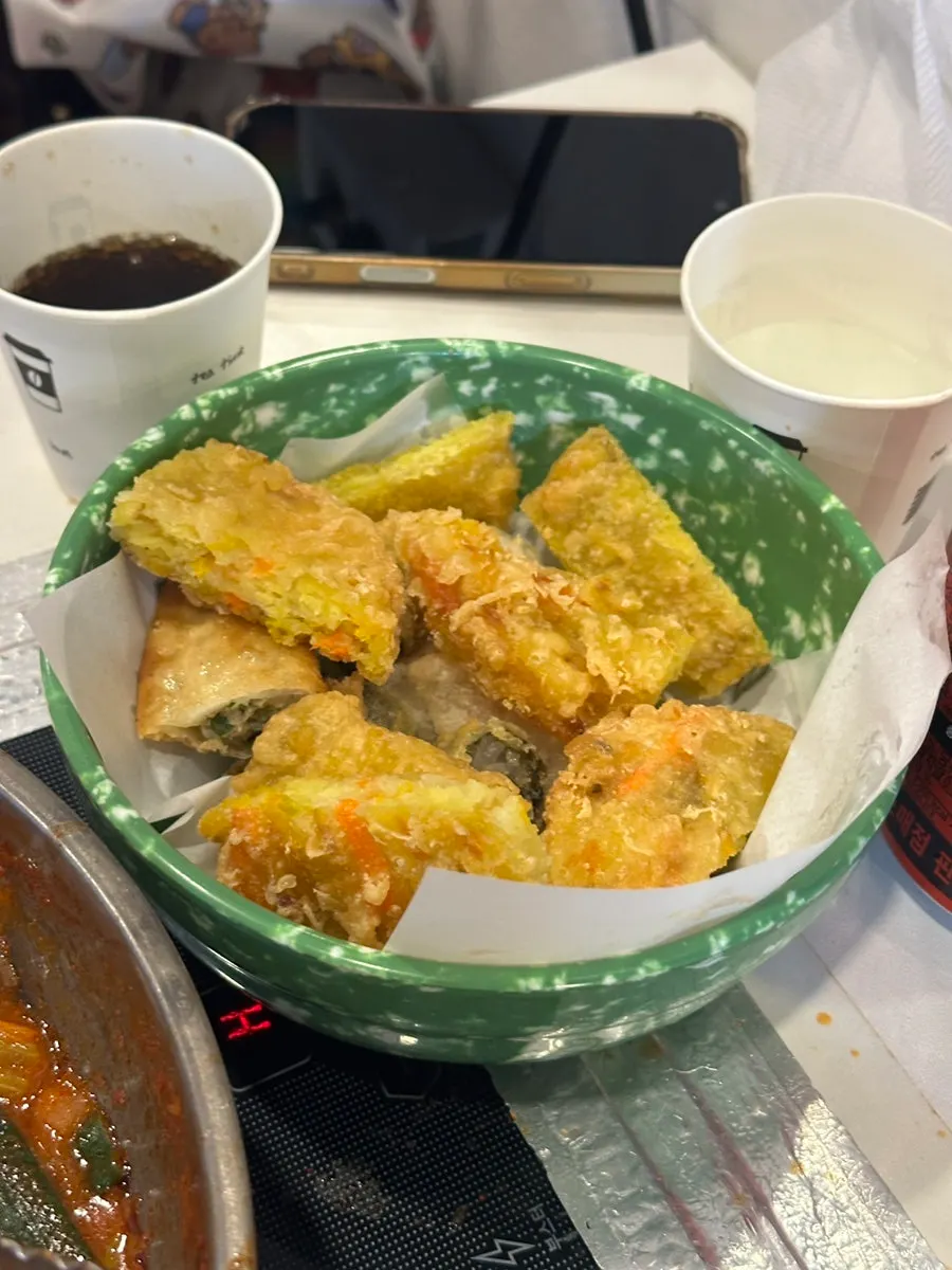 A plate of fritters ordered alongside the tteokbokki