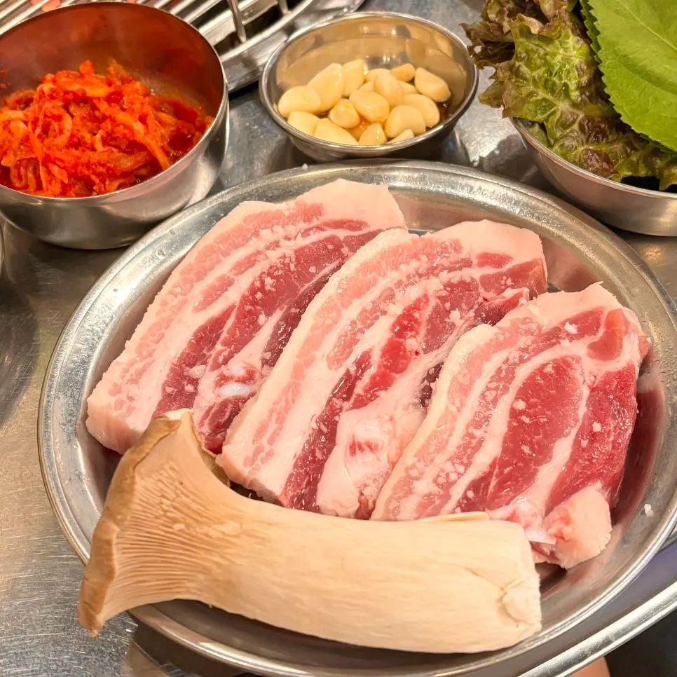 Three servings of raw pork belly lightly sprinkled with salt