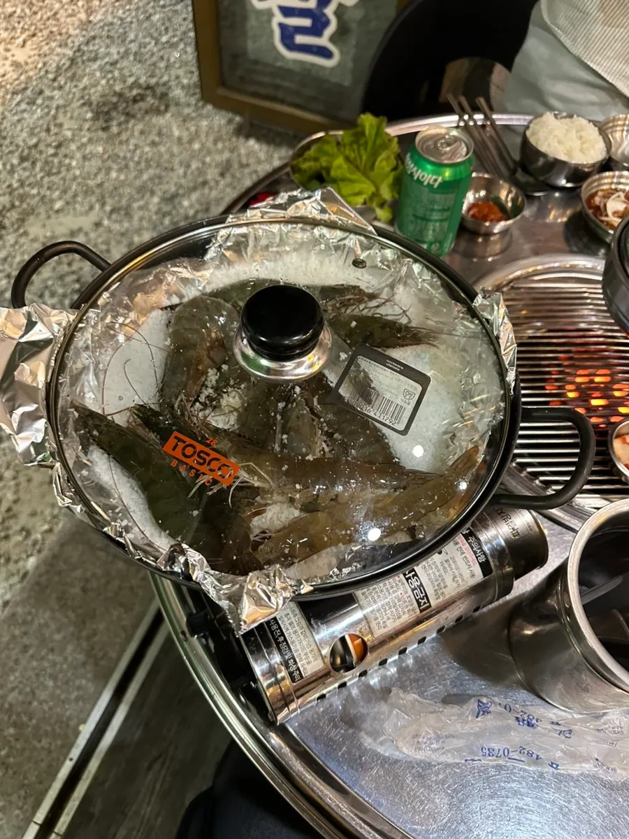 Grilled gizzard shad served with a bowl of rice