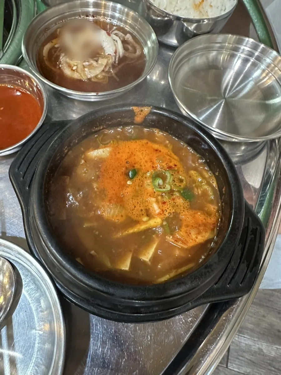 Bean sprouts and kimchi taken from the self-serve bar