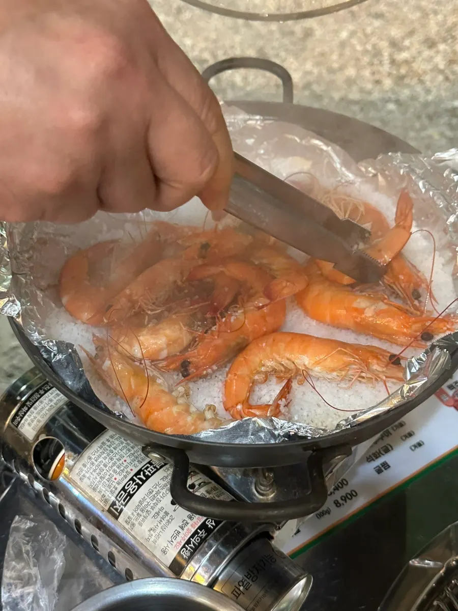 Bean sprouts and kimchi grilling over the charcoal