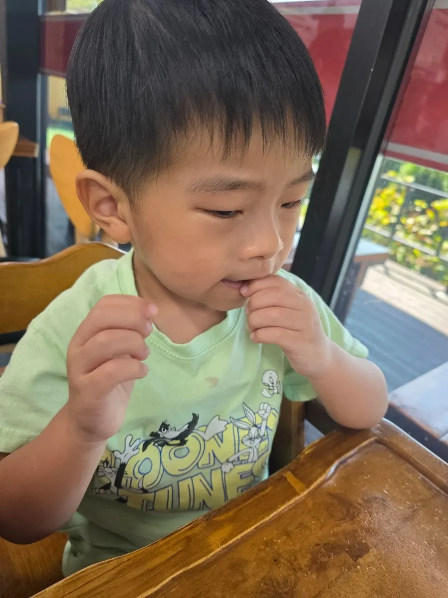 A child's first taste of octopus