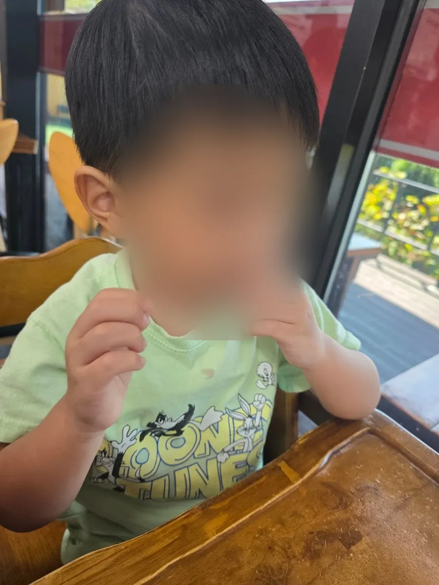 A child's first taste of octopus