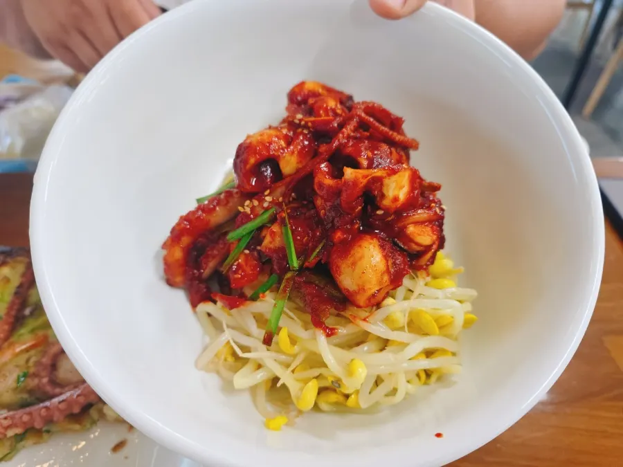 Spicy stir-fried octopus mixed with turmeric rice