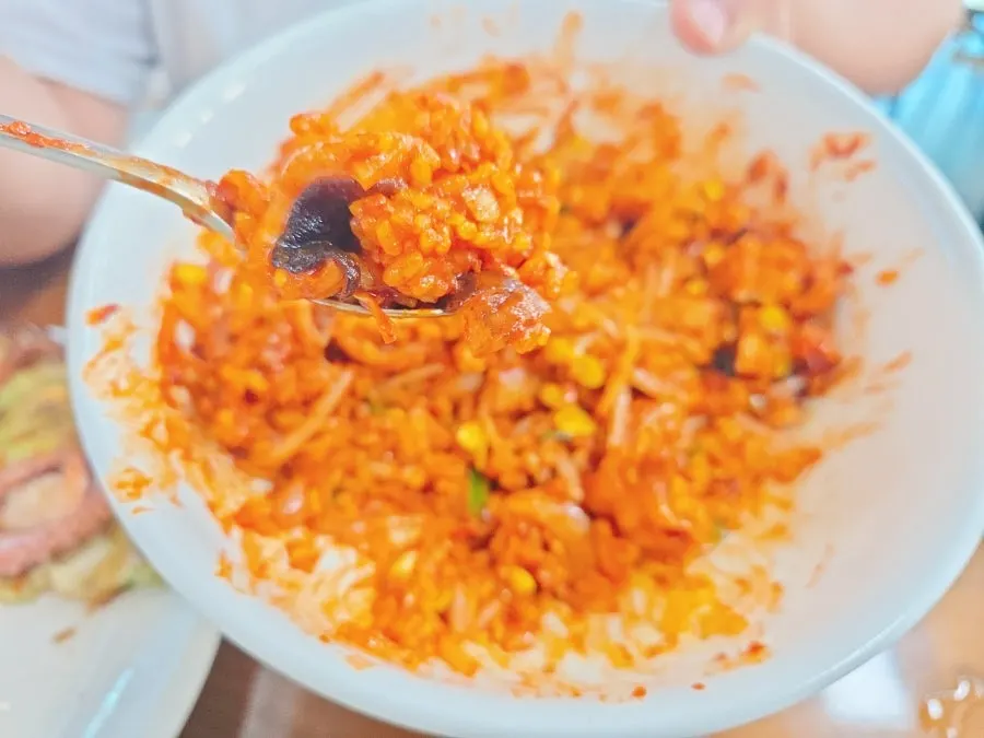 Spicy stir-fried octopus mixed with turmeric rice