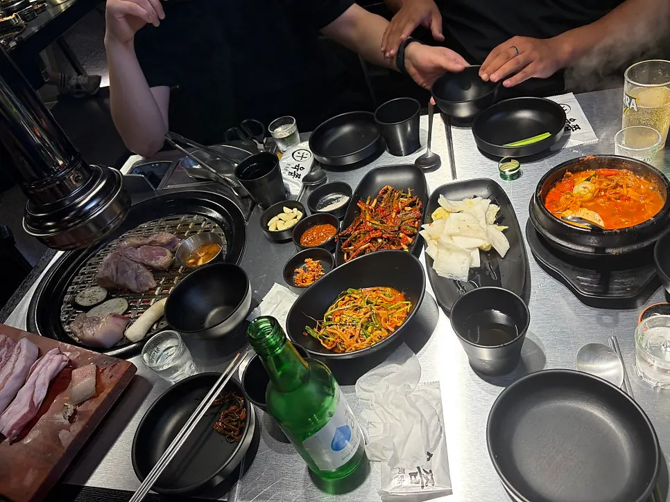 Bibimbap topped with bean sprouts and side dishes