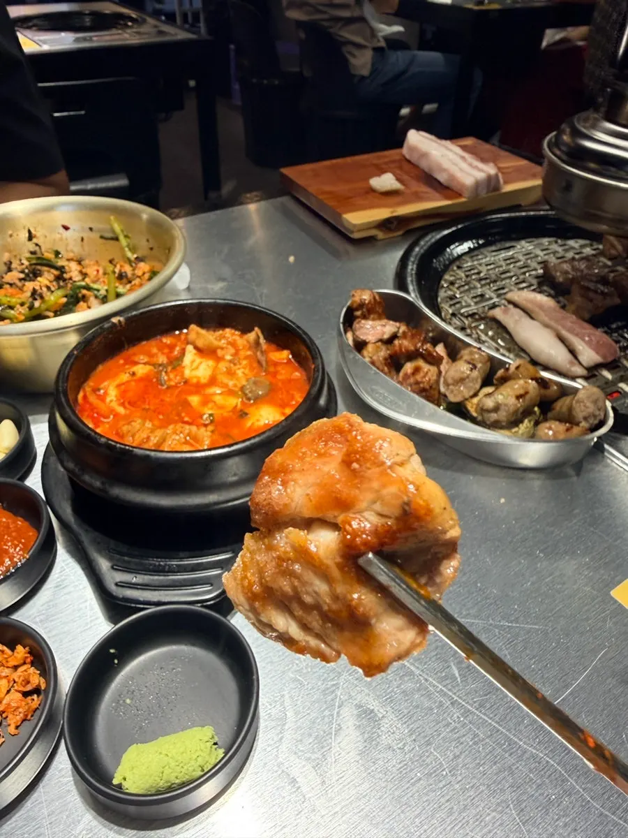 A meal with meat, stew, and rice