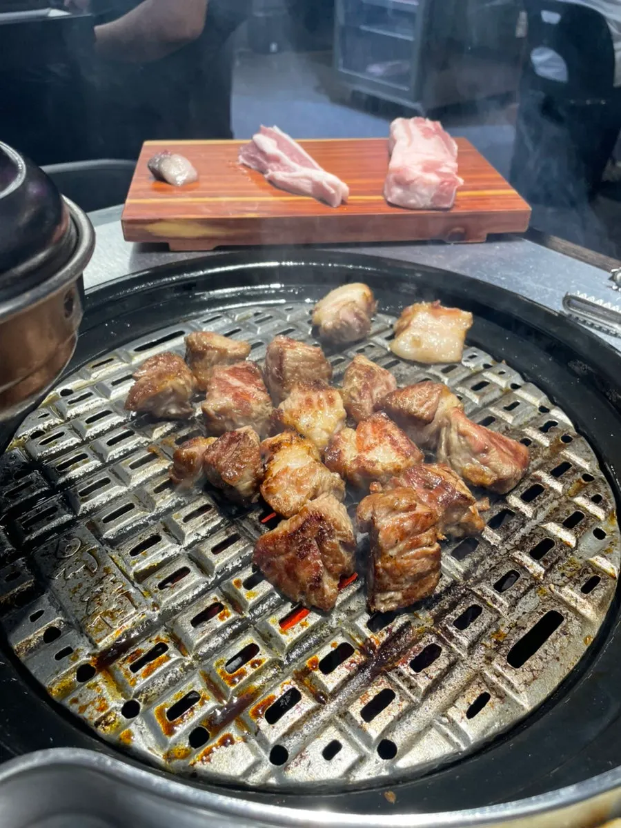 Pork neck grilling on the grill