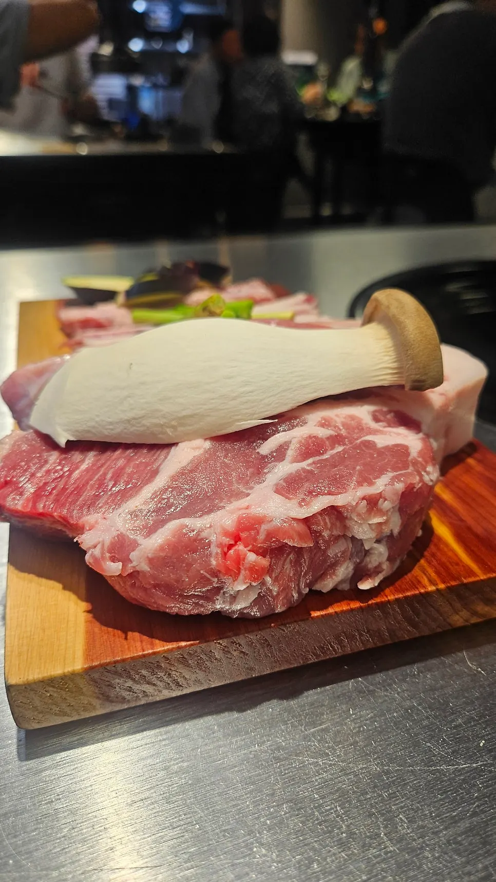 Plate of raw whole pork belly, pork neck, and gabrisal