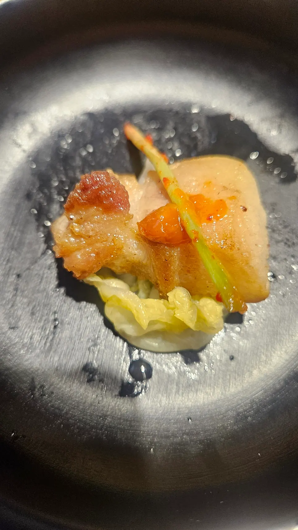 A piece of meat dipped in salt and fermented sauce