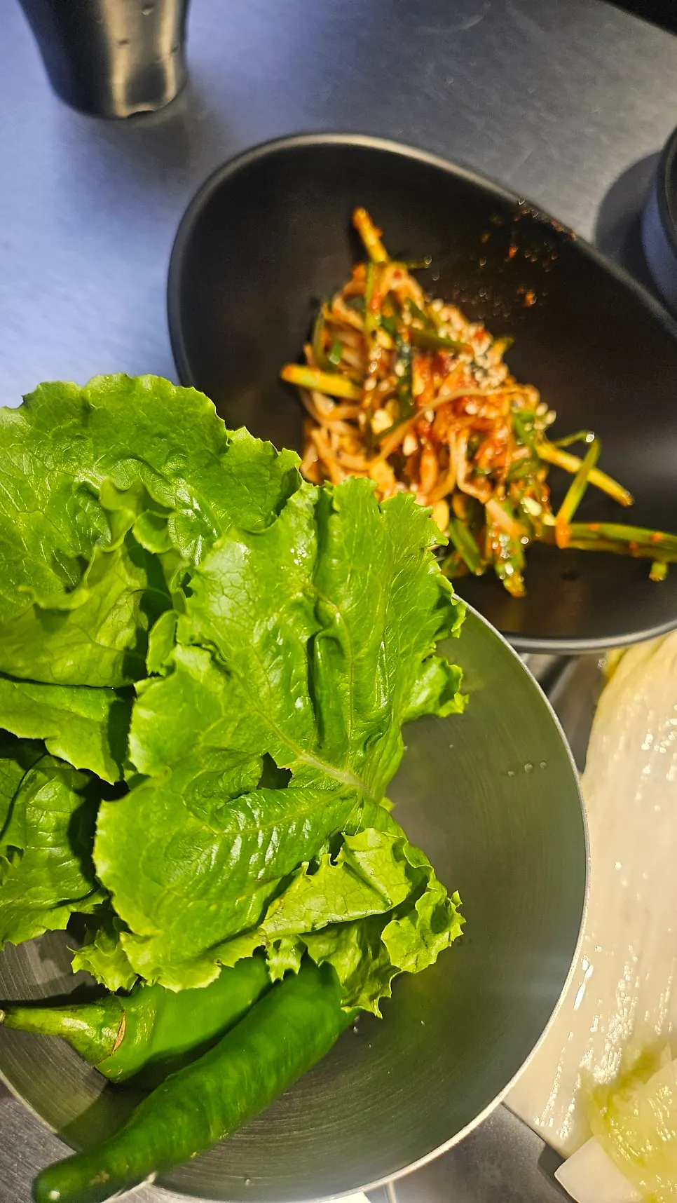 Earthenware pot of doenjang rice roll with tofu and zucchini