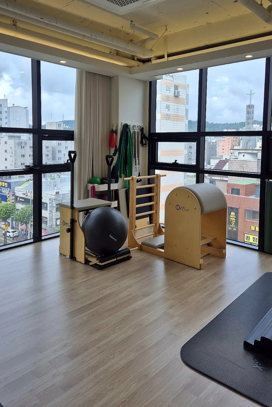 Pilates space with large windows and natural light