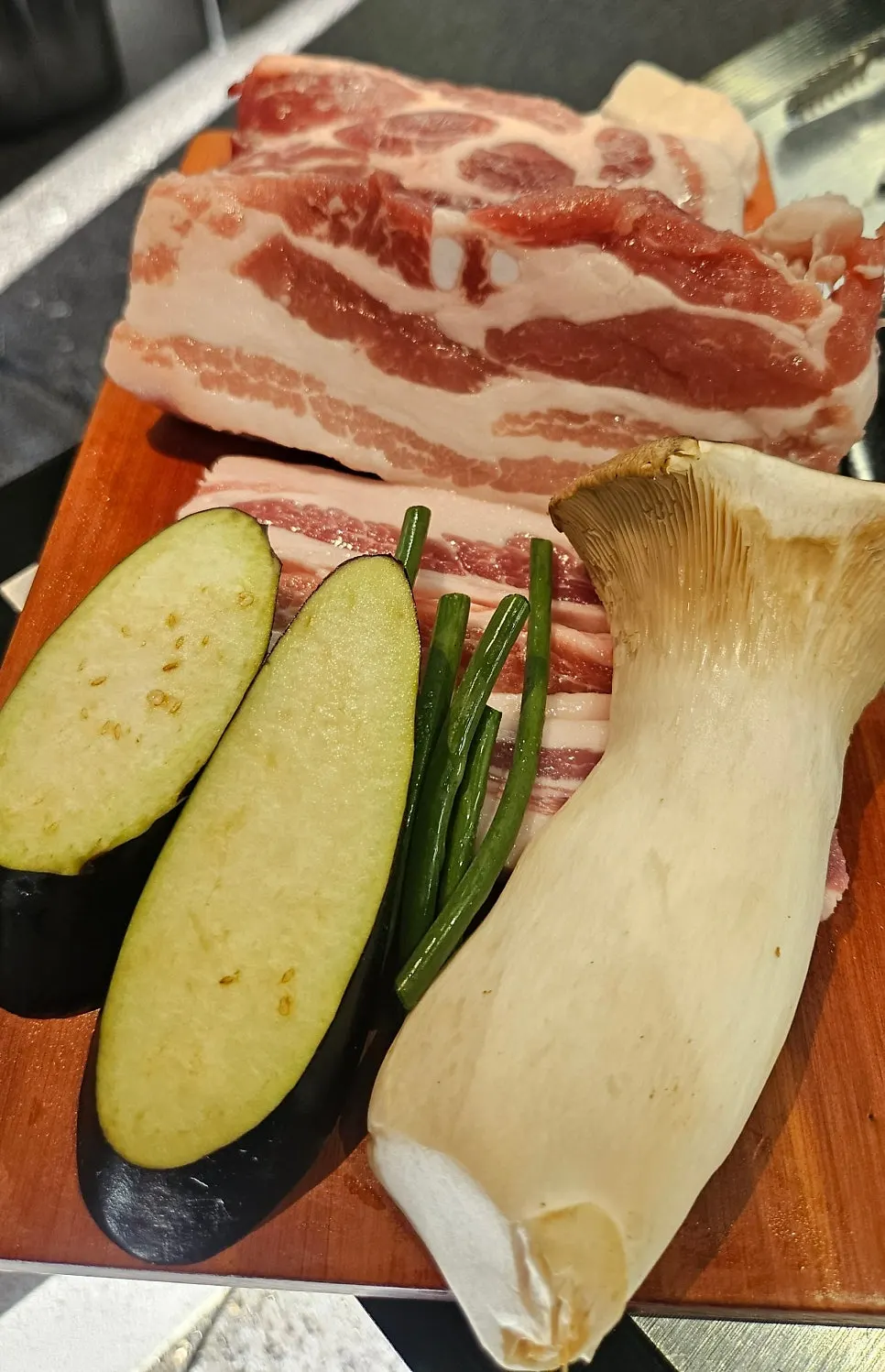 Thickly sliced pork neck, whole pork belly, and gabrisal