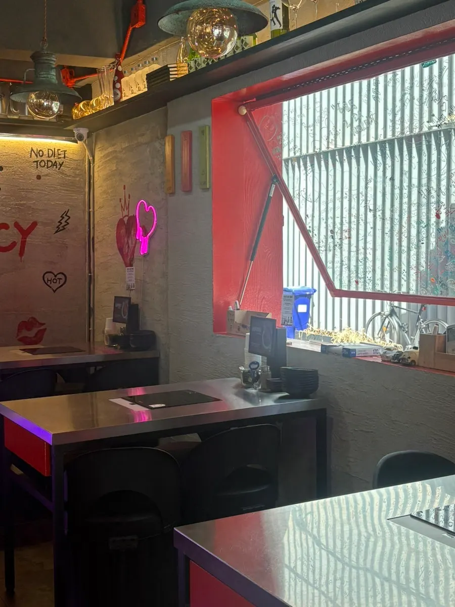 Interior with signage for takeout, delivery, and group service