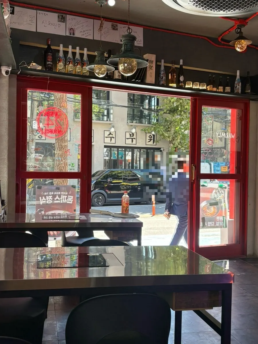 Draft beer and tteokbokki spread enjoyed for day-drinking