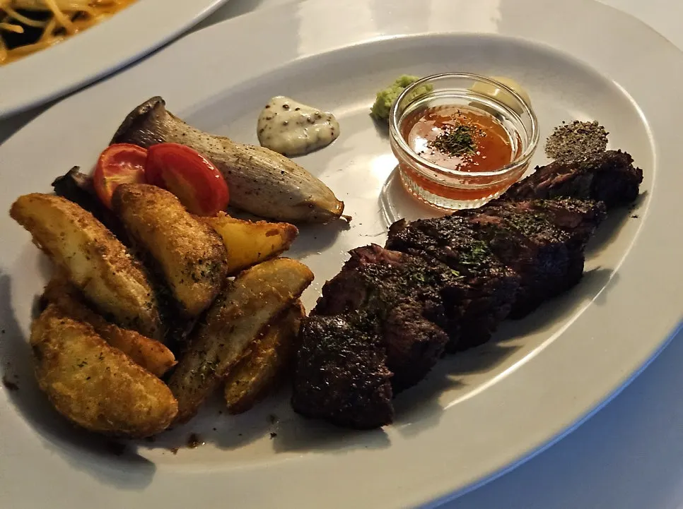 Beef sirloin steak with butter-sautéed vegetables
