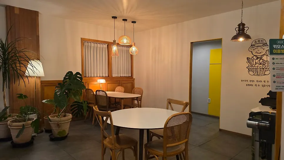 Interior decorated with wood-toned tables and rattan chairs