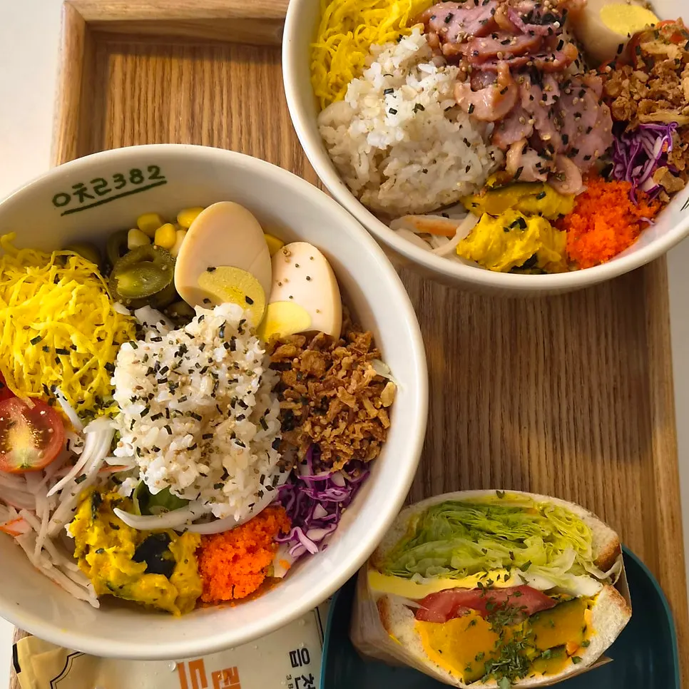 Two bowls of poke on the table