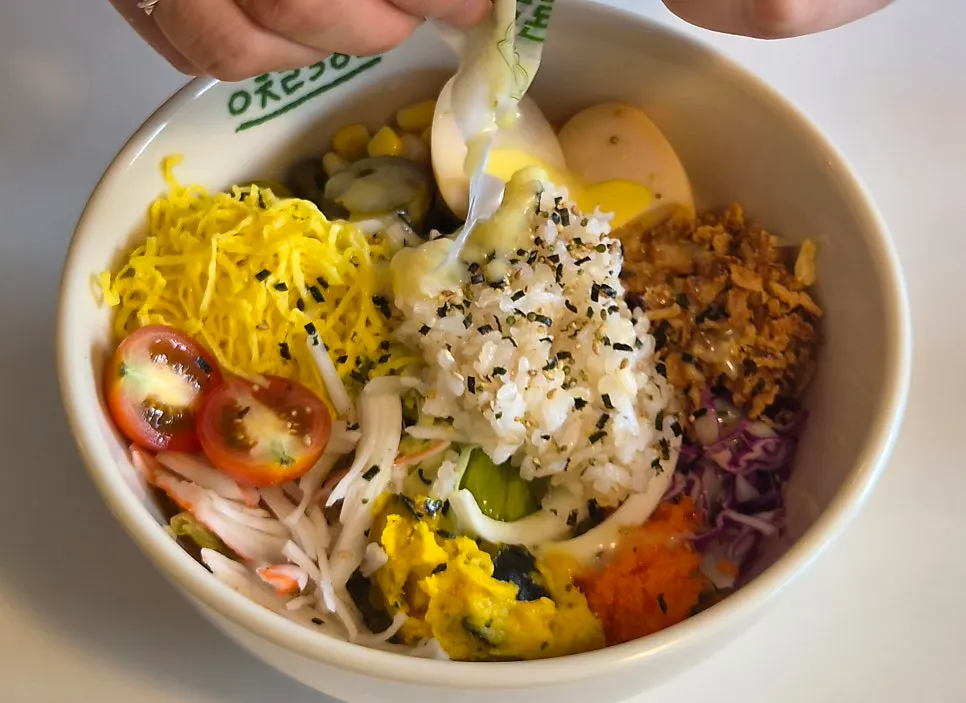 Poke salad mixed together like bibimbap
