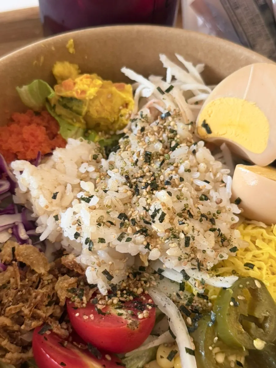 A spoonful of the poke salad lifted up
